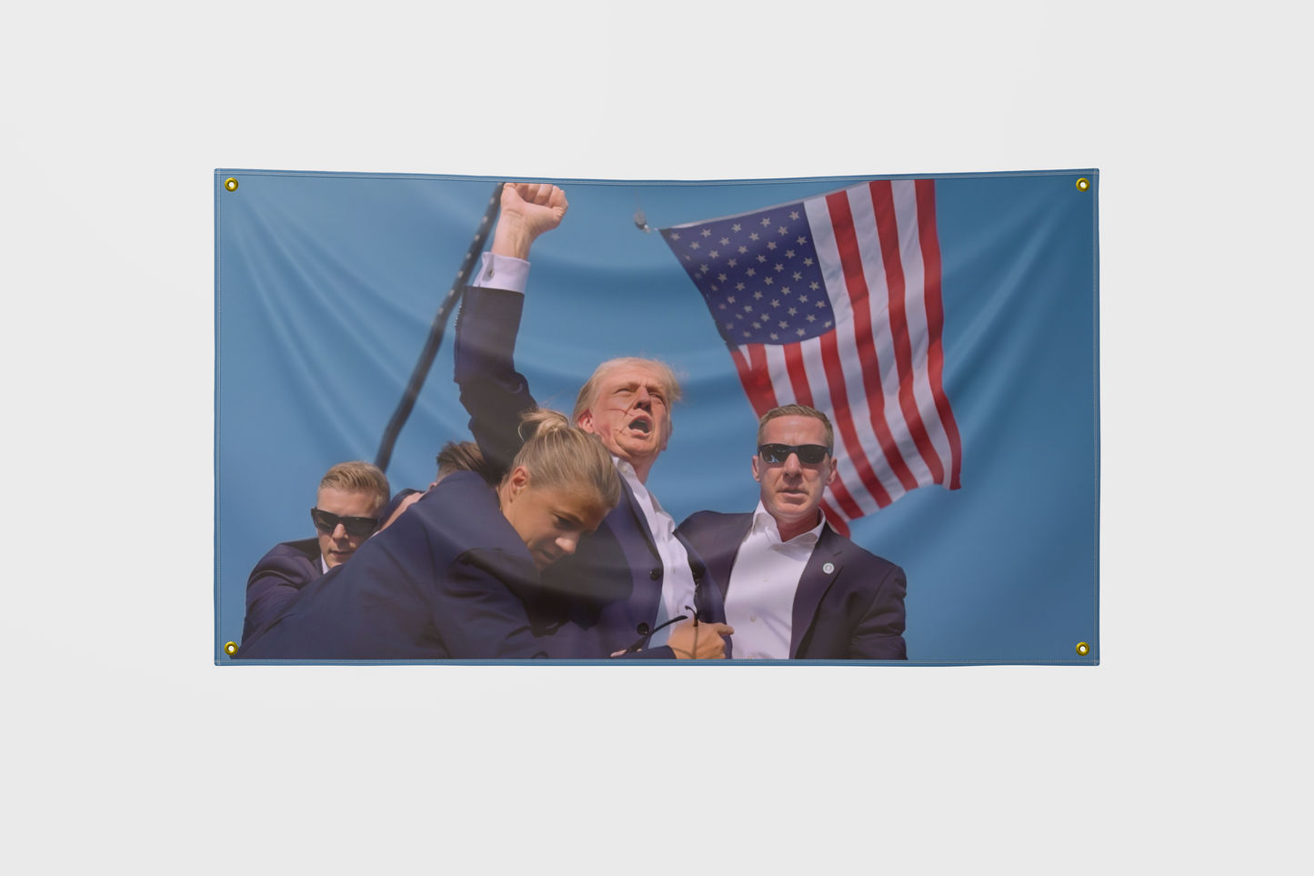 Iconic Trump Assassination Attempt Flag featuring a striking design, made from high-quality polyester with reinforced grommets, symbolizing defiance and challenging mainstream narratives.